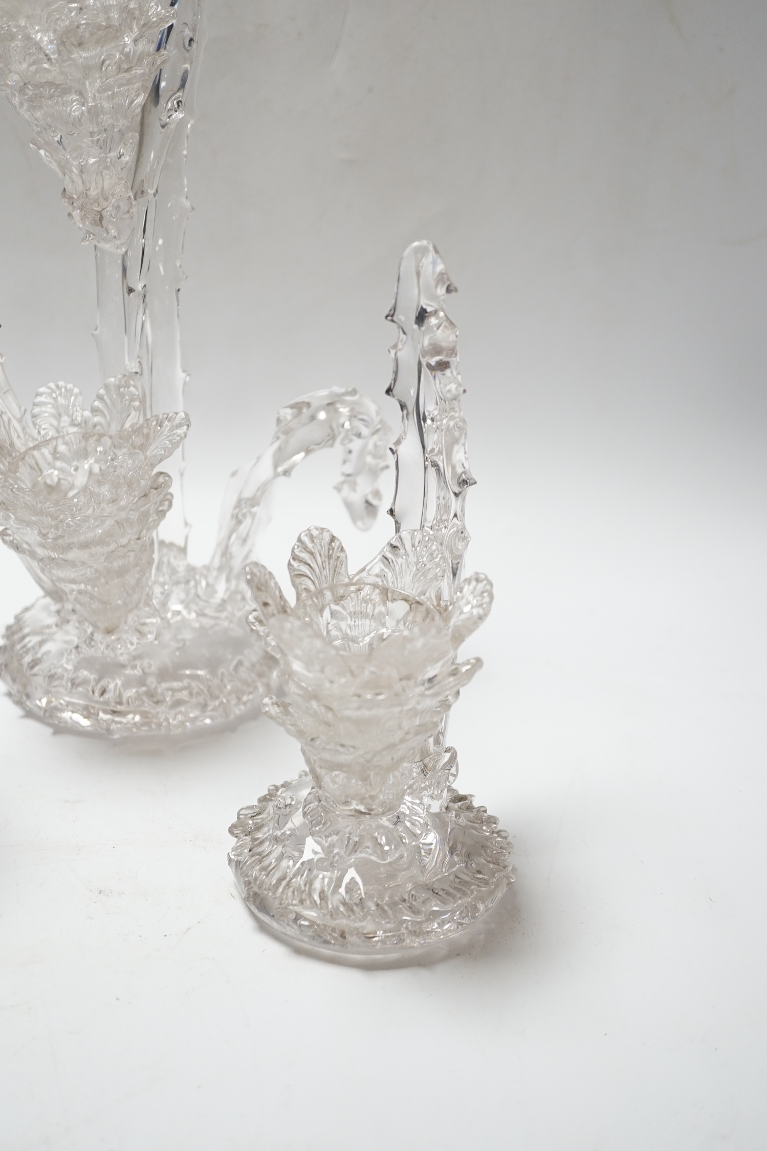 A set of four glass stylistic floral candlesticks, (one double holder the other three single holder), tallest 33cm high